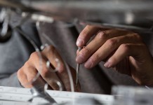 Image of hands building a scale model