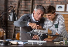 Image of father and son building scale model of DC3