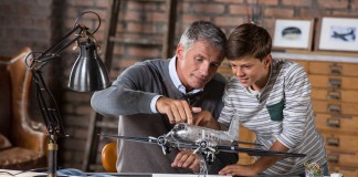 Image of father and son building scale model of DC3