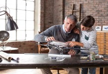 Image of a father and son building a scale model Douglas DC3 airplane, as part of a blog about the top 5 reasons to build scale models with your children.