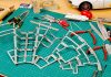 Image of a scale model cutting board with tools and a DeAgostini ModelSpace Millennium Falcon model, as part of a blog about the best Christmas gift ideas for craft lovers