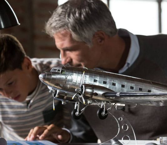 Image of a father and son building a ModelSpace Douglas DC3 scale model, as part of a blog about activities to do at home.