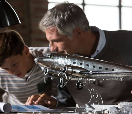 Image of father and son building the ModelSpace 1:32 scale Douglas DC-3 model plane, as part of a blog about indoor activities for families on rainy days