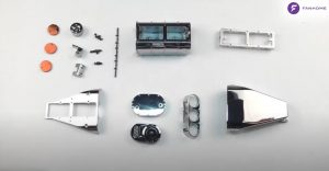 Still life photography of several pieces of Fanhome's Dodge Charger model.